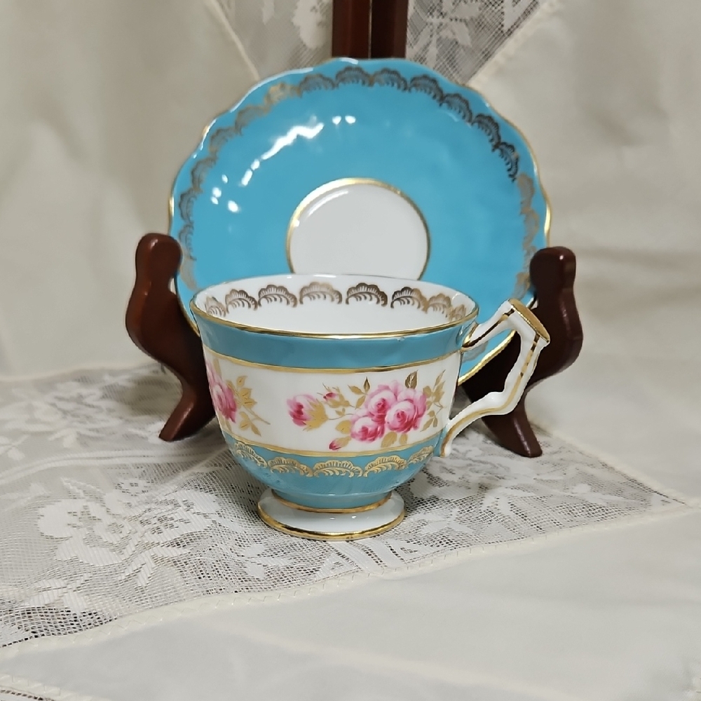 Vintage Blue and Gold Teacup with Floral Design